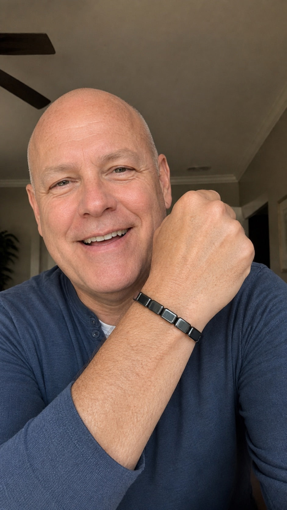 Man presenting an adjustable hematite bracelet